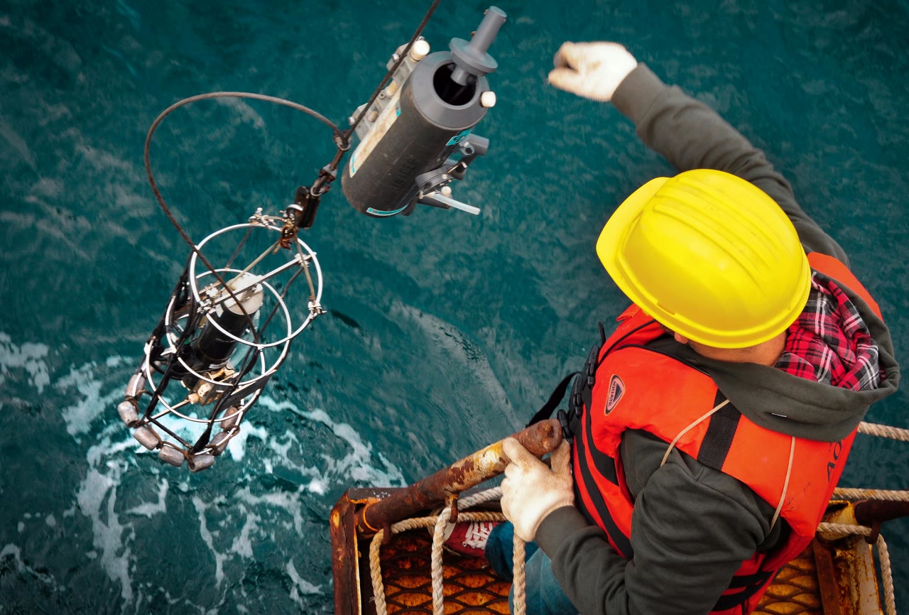A person working on an offshore platform at sea.